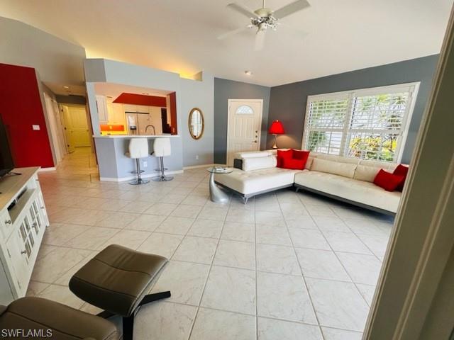 224 Napa Ridge Road East, Unit 12 Naples, FL 34119 - Photo 16 of 33 a living room with furniture and a window