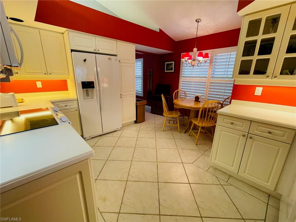 224 Napa Ridge Road East, Unit 12 Naples, FL 34119 - Photo 22 of 33 a utility room with dryer and washer