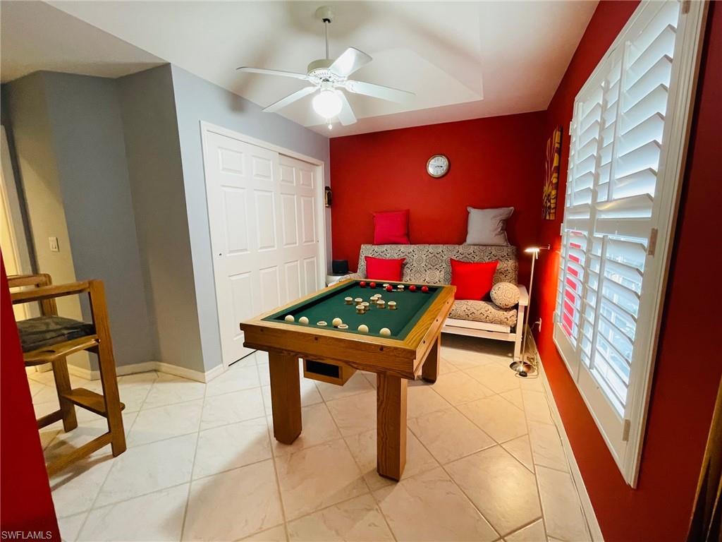 224 Napa Ridge Road East, Unit 12 Naples, FL 34119 - Photo 24 of 33 a room with furniture