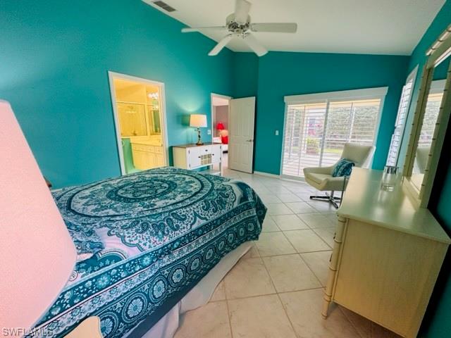 224 Napa Ridge Road East, Unit 12 Naples, FL 34119 - Photo 27 of 33 a living room with a bed furniture and a large window