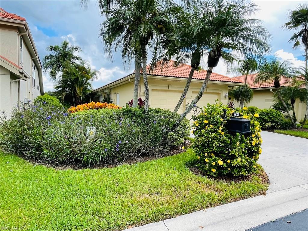 224 Napa Ridge Road East, Unit 12 Naples, FL 34119 - Photo 3 of 33 a view of a backyard with a garden