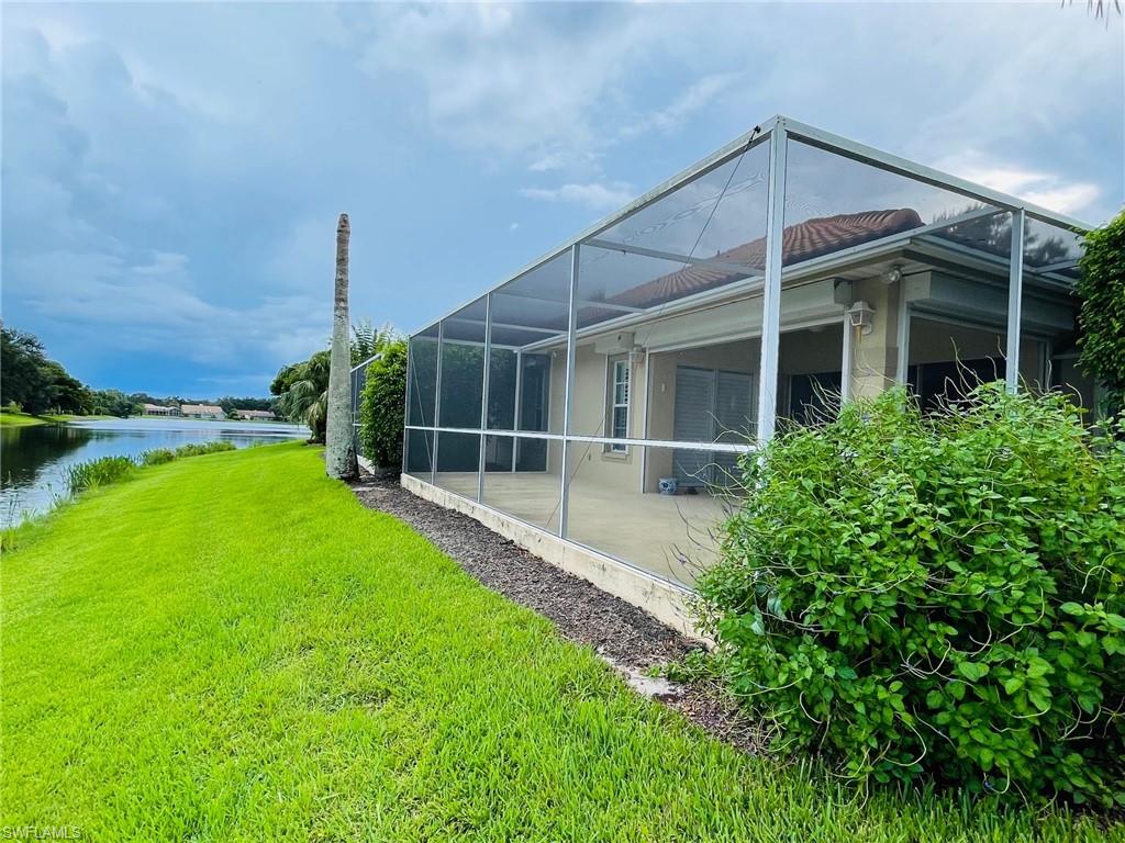 224 Napa Ridge Road East, Unit 12 Naples, FL 34119 - Photo 9 of 33 a view of an house with backyard space and garden view