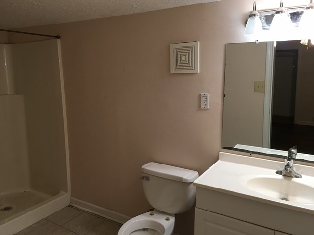 6395 Skipper Road Macon, GA 31216 - Photo 6 of 10 a bathroom with a sink and a toilet