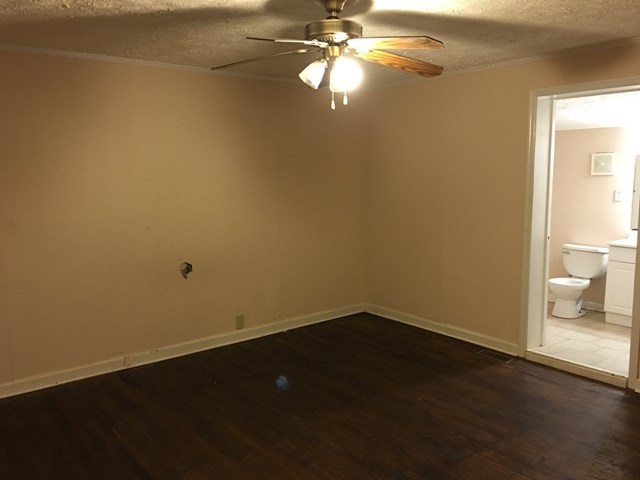 6395 Skipper Road Macon, GA 31216 - Photo 7 of 10 a view of an empty room with wooden floor and a window