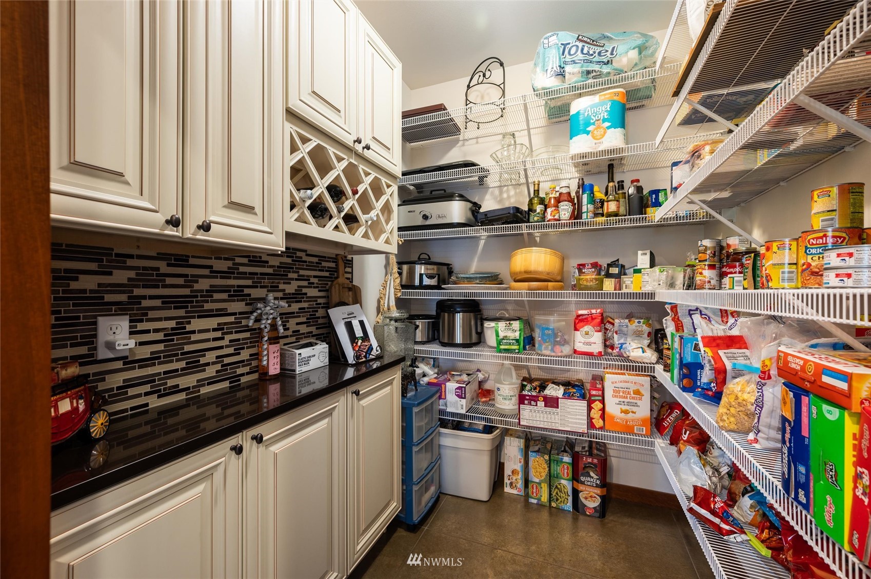1060 Carpenter Road Bellingham, WA 98226 - Photo 11 of 37 a kitchen with lots of clutter and cabinets