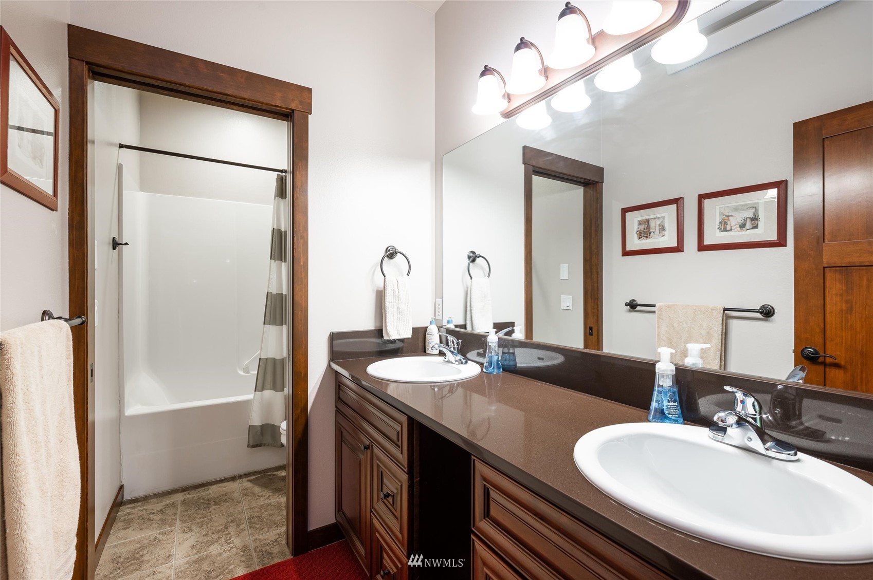 1060 Carpenter Road Bellingham, WA 98226 - Photo 23 of 37 a bathroom with a sink a mirror and a shower