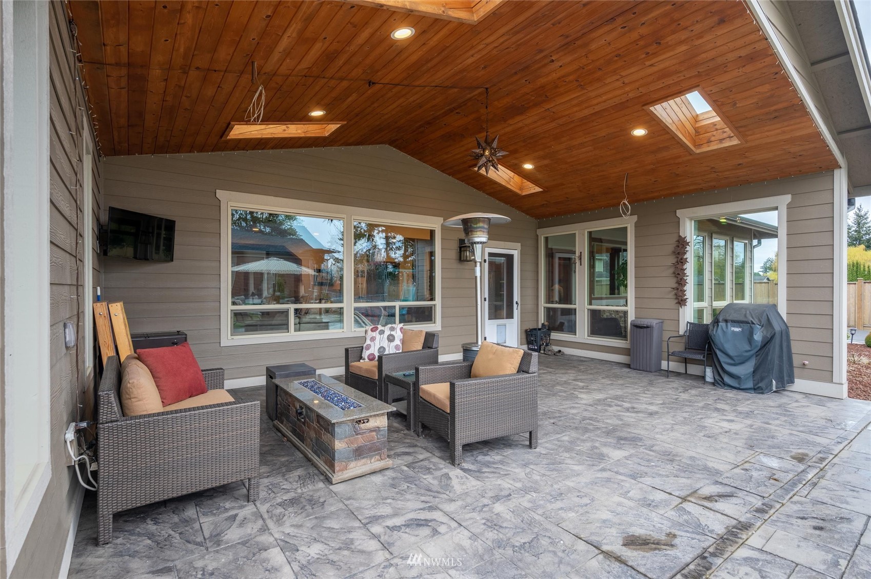 1060 Carpenter Road Bellingham, WA 98226 - Photo 27 of 37 a outdoor living space with patio furniture and a fireplace