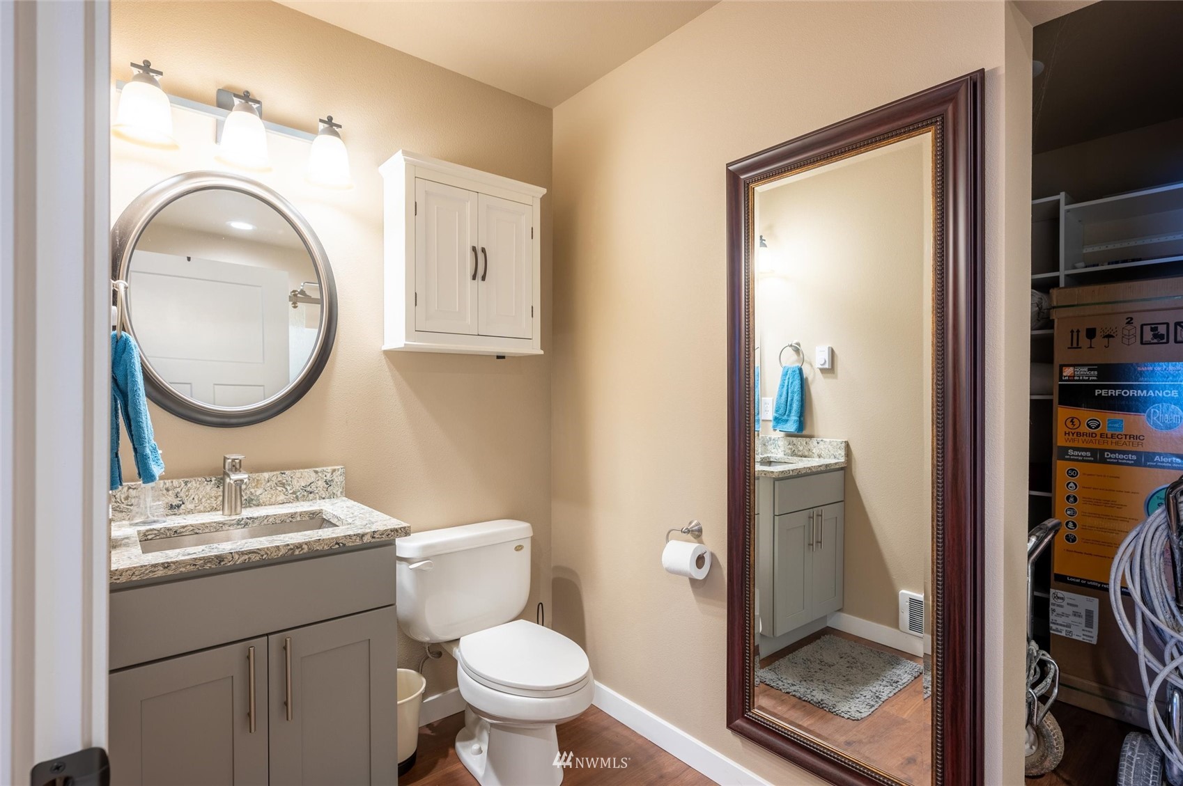 1060 Carpenter Road Bellingham, WA 98226 - Photo 35 of 37 a bathroom with a toilet a sink and a mirror