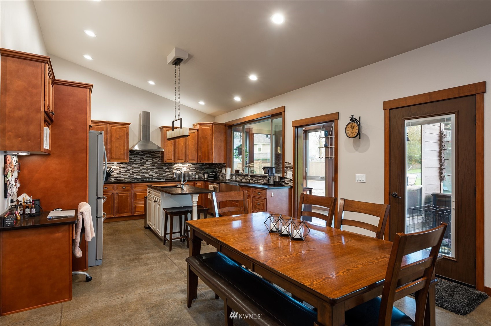 1060 Carpenter Road Bellingham, WA 98226 - Photo 6 of 37 a dining room with stainless steel appliances kitchen island granite countertop a dining table and chairs