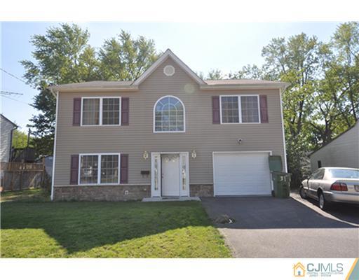 31 Parkerson Road Edison, NJ 08817 - Photo 1 of 6 a view of a house with a yard