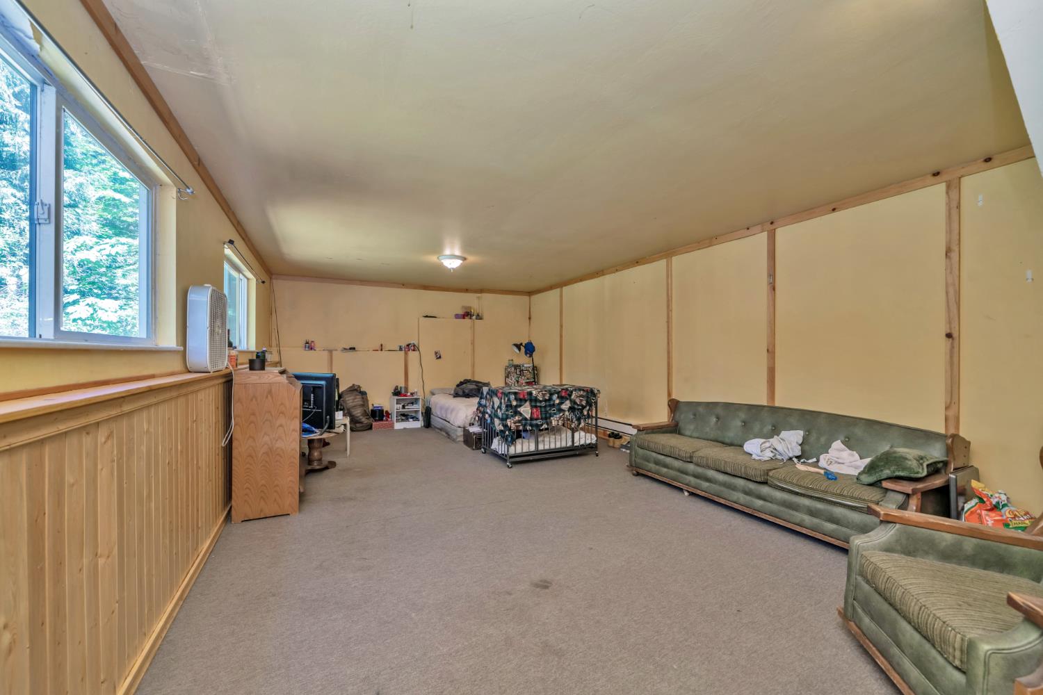 6929 Split Bend Road Pollock Pines, CA 95726 - Photo 31 of 38 a view of a livingroom with furniture and a window