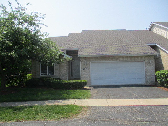 1901 Calla Drive Joliet, IL 60435 - Photo 1 of 27 a front view of a house with a yard and a garage