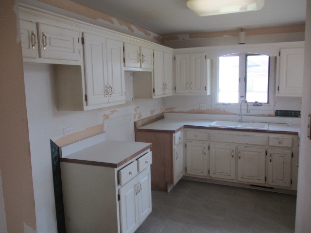 1901 Calla Drive Joliet, IL 60435 - Photo 5 of 27 a kitchen with white cabinets sink and window
