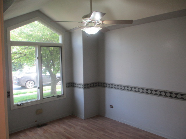 1901 Calla Drive Joliet, IL 60435 - Photo 10 of 27 a view of a room with window wooden floor and windows