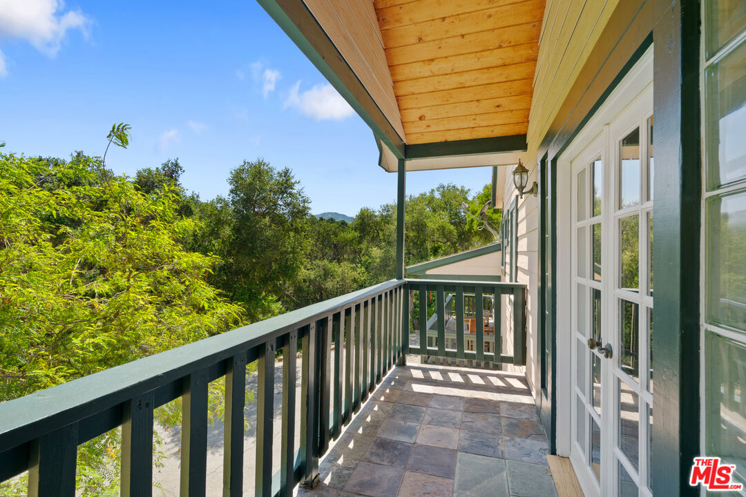 20912 Fontaine Road Topanga, CA 90290 - Photo 9 of 52 a view of a balcony with wooden floor