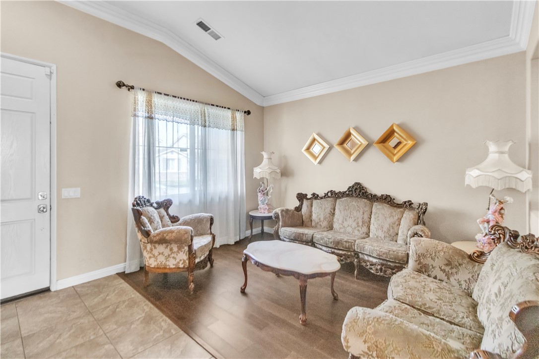 29180 Meandering Circle Menifee, CA 92584 - Photo 7 of 16 a living room with furniture and a window
