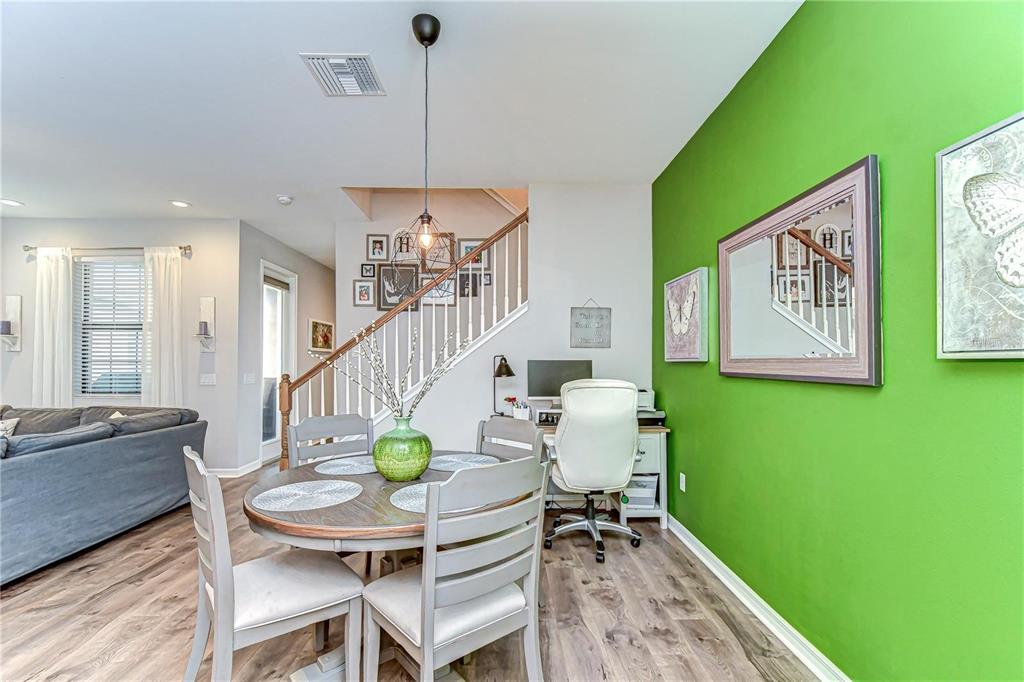 5703 Colony Glen Road Lithia, FL 33547 - Photo 16 of 53 a dining room with furniture and a garden