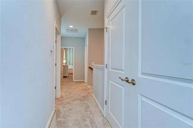 a bathroom with a granite countertop sink and a mirror with toilet