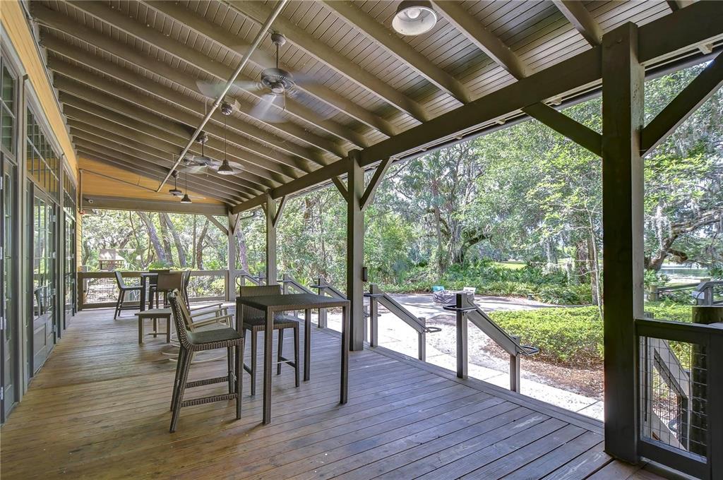5703 Colony Glen Road Lithia, FL 33547 - Photo 46 of 53 a view of a patio with table and chairs and wooden floor