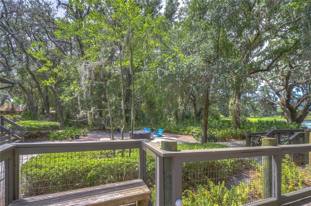 5703 Colony Glen Road Lithia, FL 33547 - Photo 49 of 53 a view of backyard with a large pool and outdoor seating