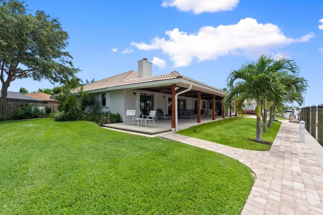 a view of an entrance to house with yard