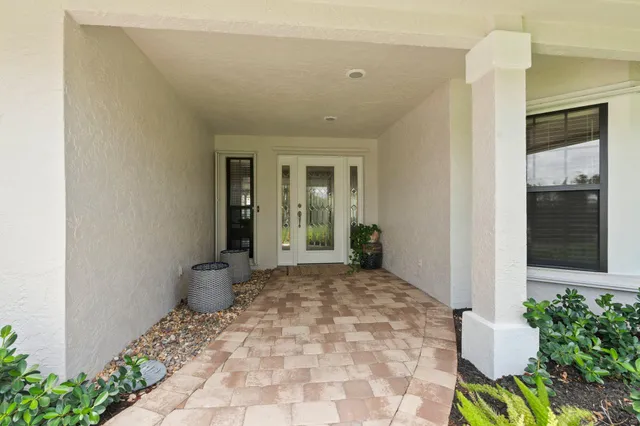 a view of a livingroom with furniture and front door