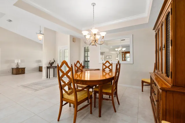 a kitchen with stainless steel appliances granite countertop a refrigerator a stove and a sink with dishwasher