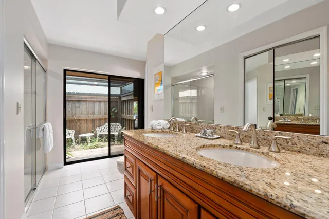 a bathroom with a glass shower door
