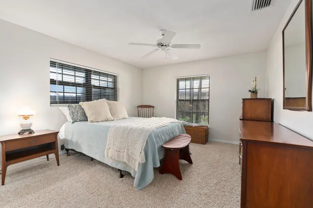 a view of a patio with chairs and a table
