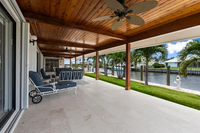 a view of swimming pool with a patio