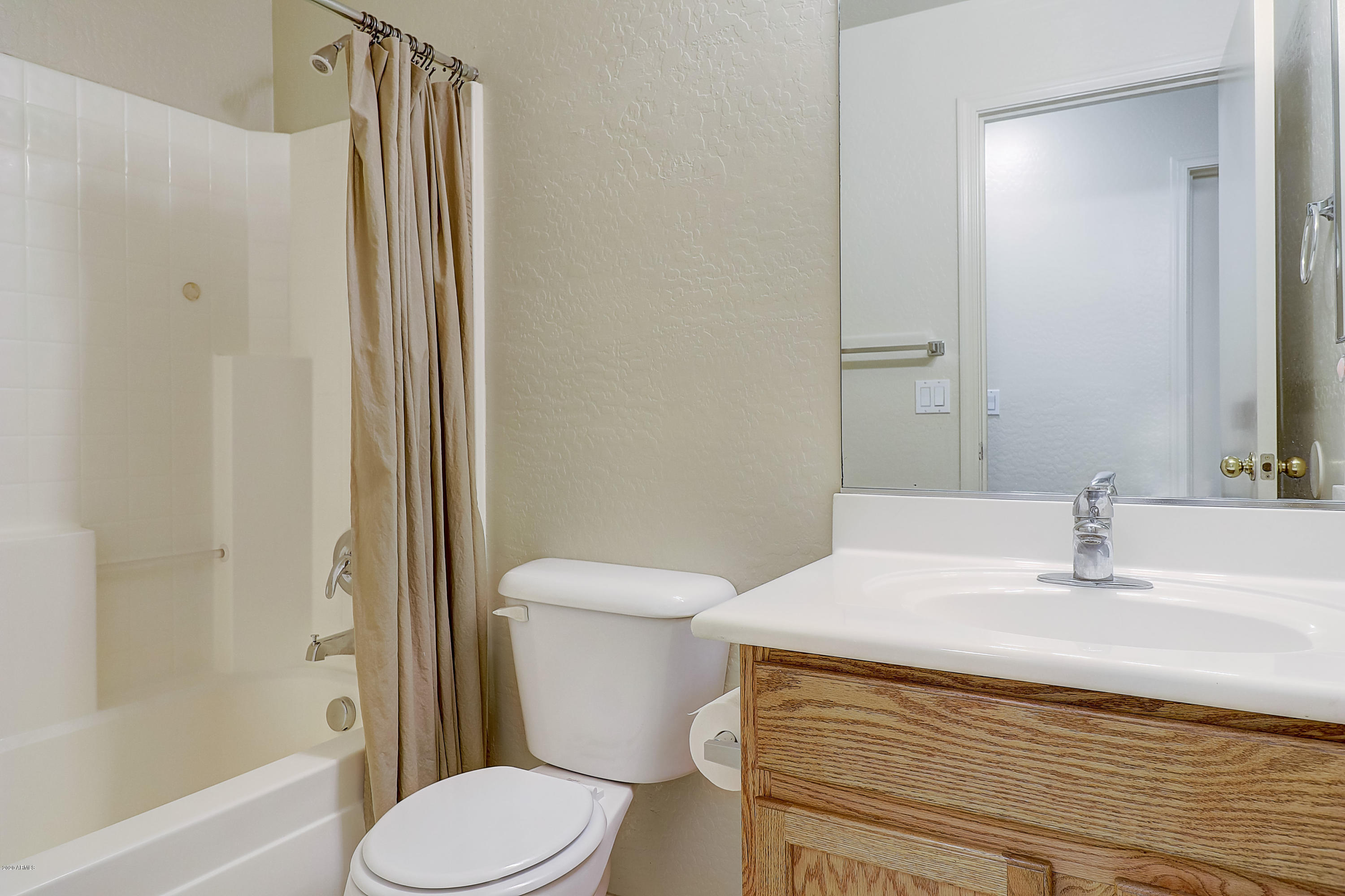 8461 West Riley Road Tolleson, AZ 85353 - Photo 16 of 25 a bathroom with a sink a toilet and shower
