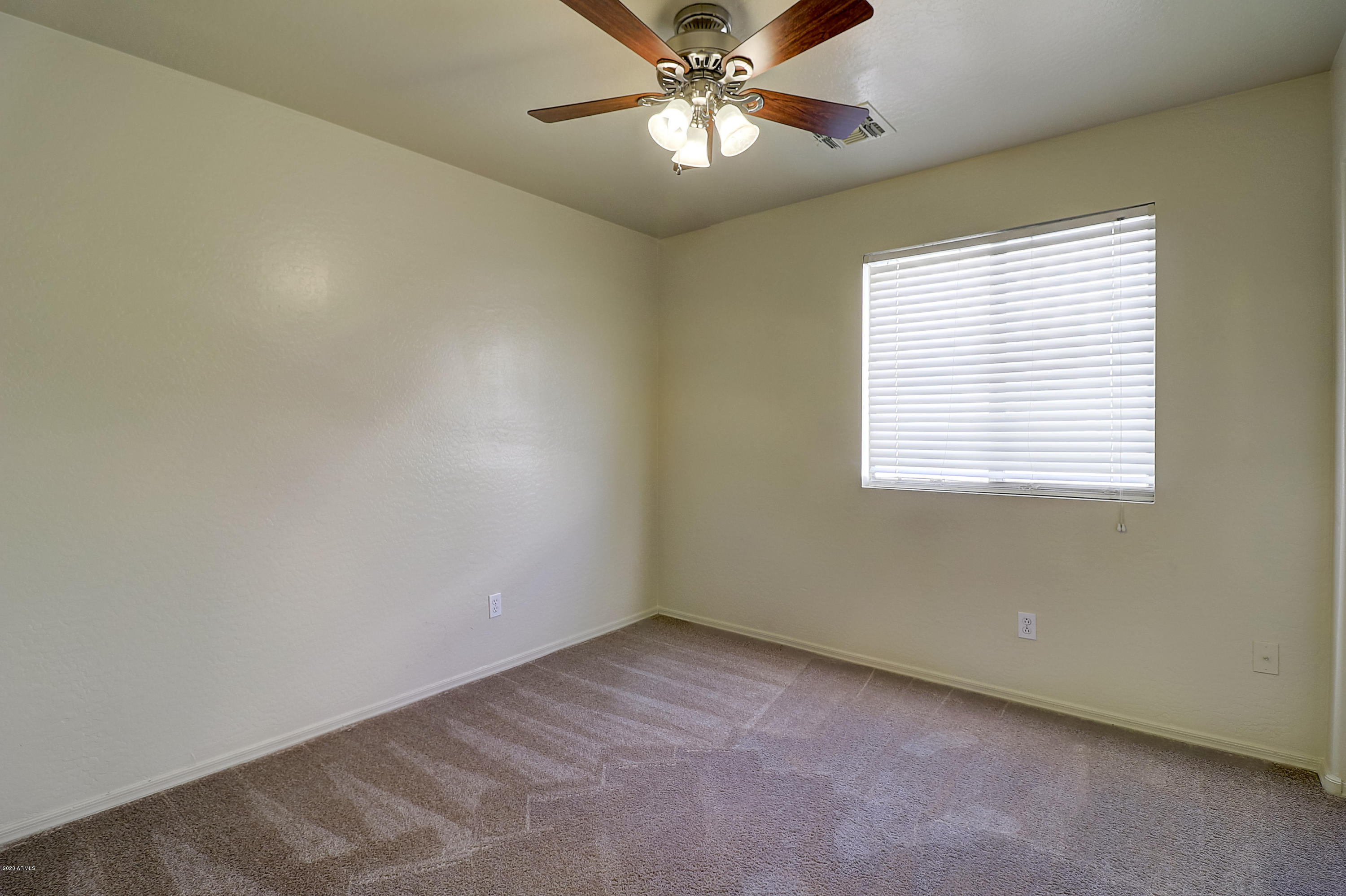 8461 West Riley Road Tolleson, AZ 85353 - Photo 19 of 25 an empty room with a window