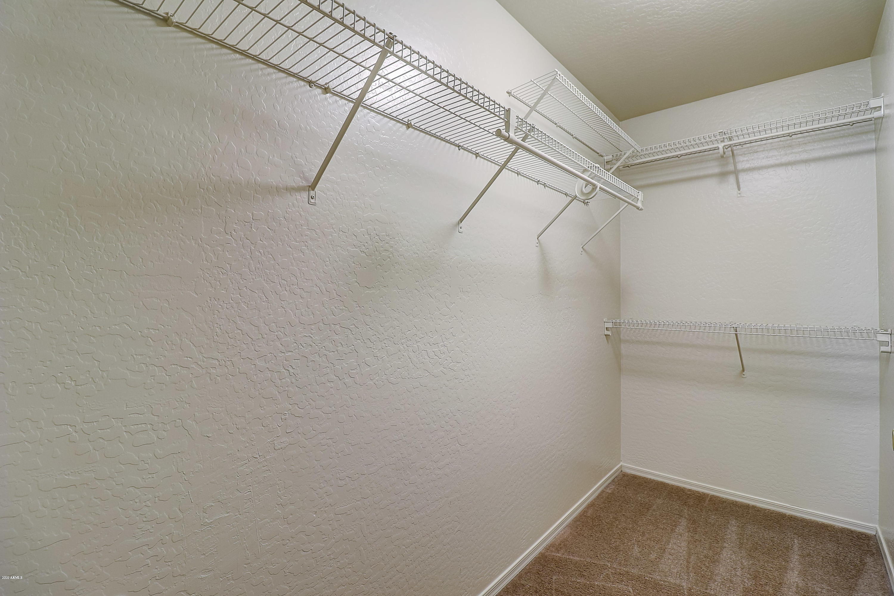 8461 West Riley Road Tolleson, AZ 85353 - Photo 23 of 25 a view of a room with racks on the wall