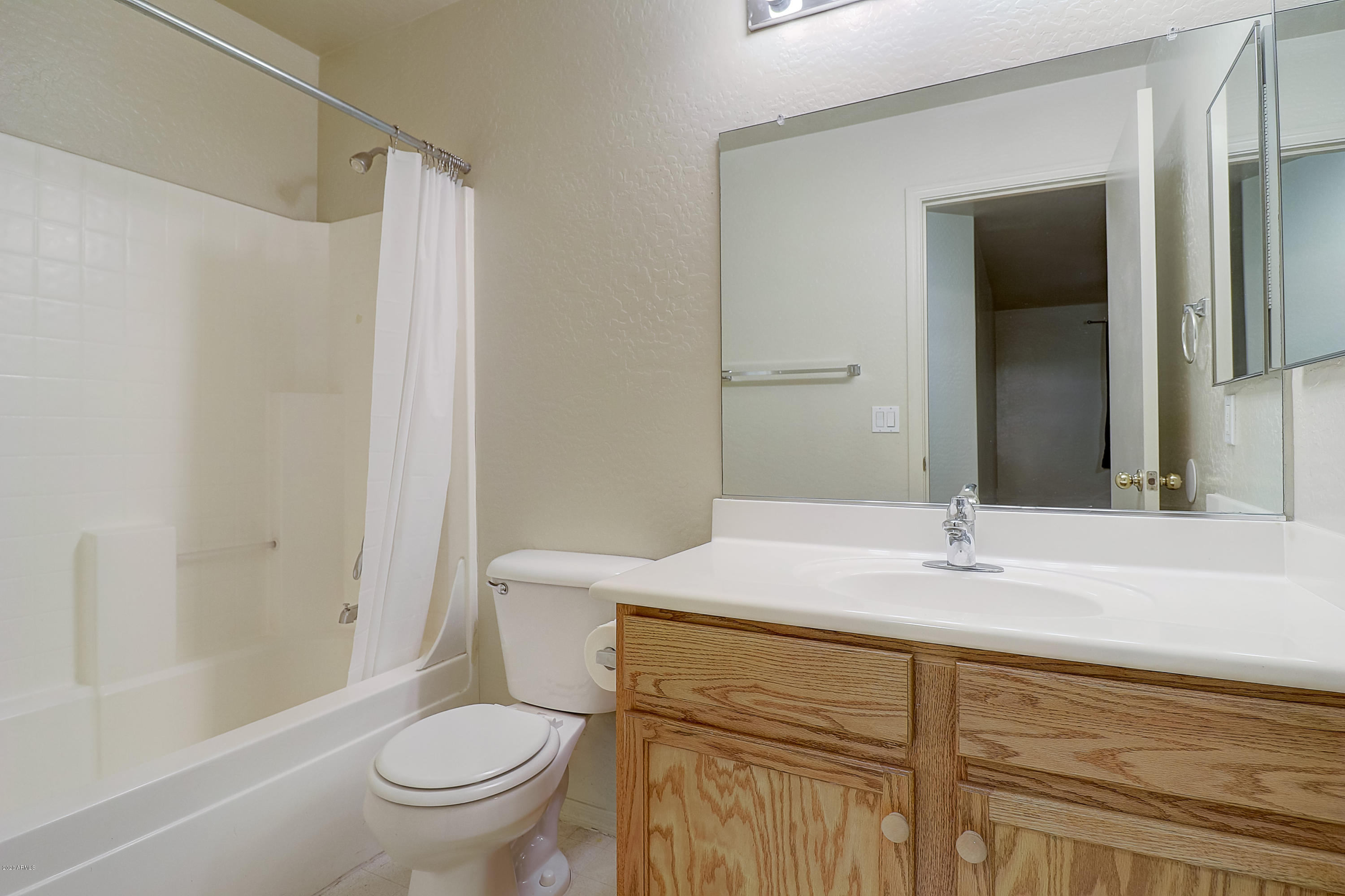 8461 West Riley Road Tolleson, AZ 85353 - Photo 24 of 25 a bathroom with a sink and a mirror