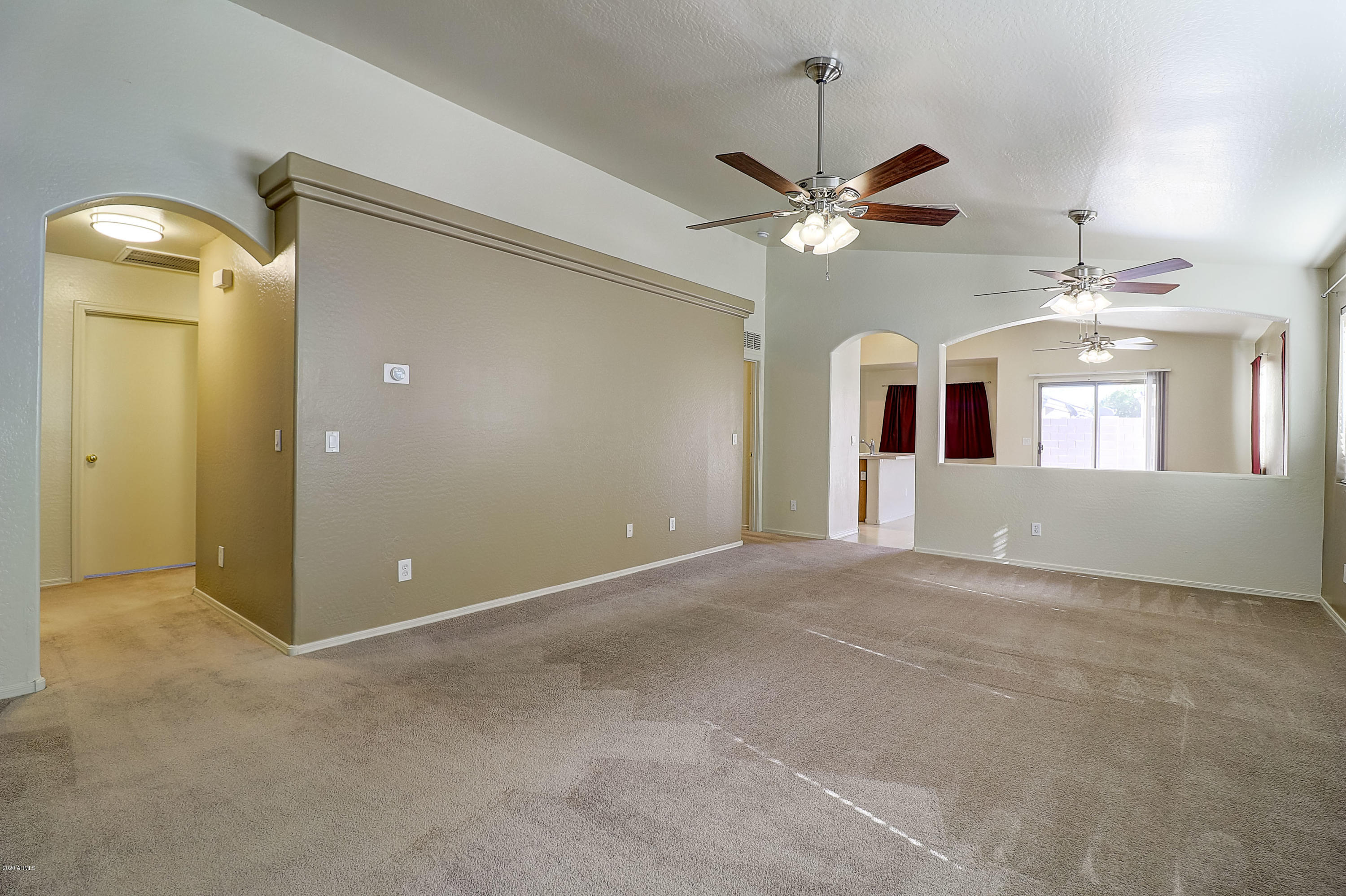 8461 West Riley Road Tolleson, AZ 85353 - Photo 6 of 25 a view of an empty room and a ceiling fan