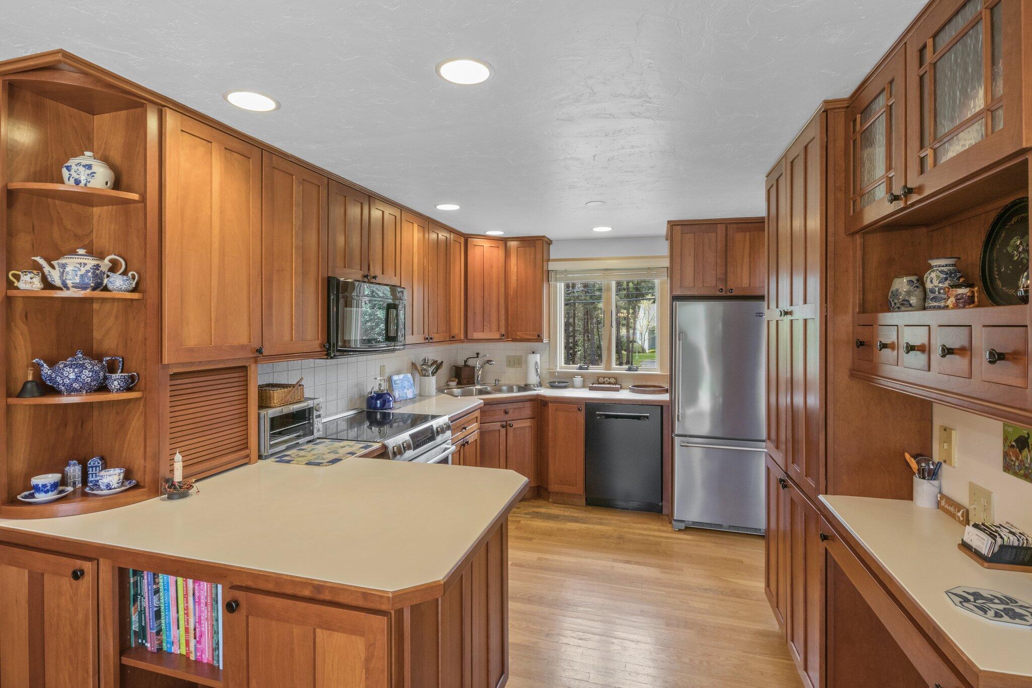 1363 Old Post Road Marstons Mills, MA 02648 - Photo 12 of 41 a kitchen with a refrigerator a stove top oven a sink and dishwasher