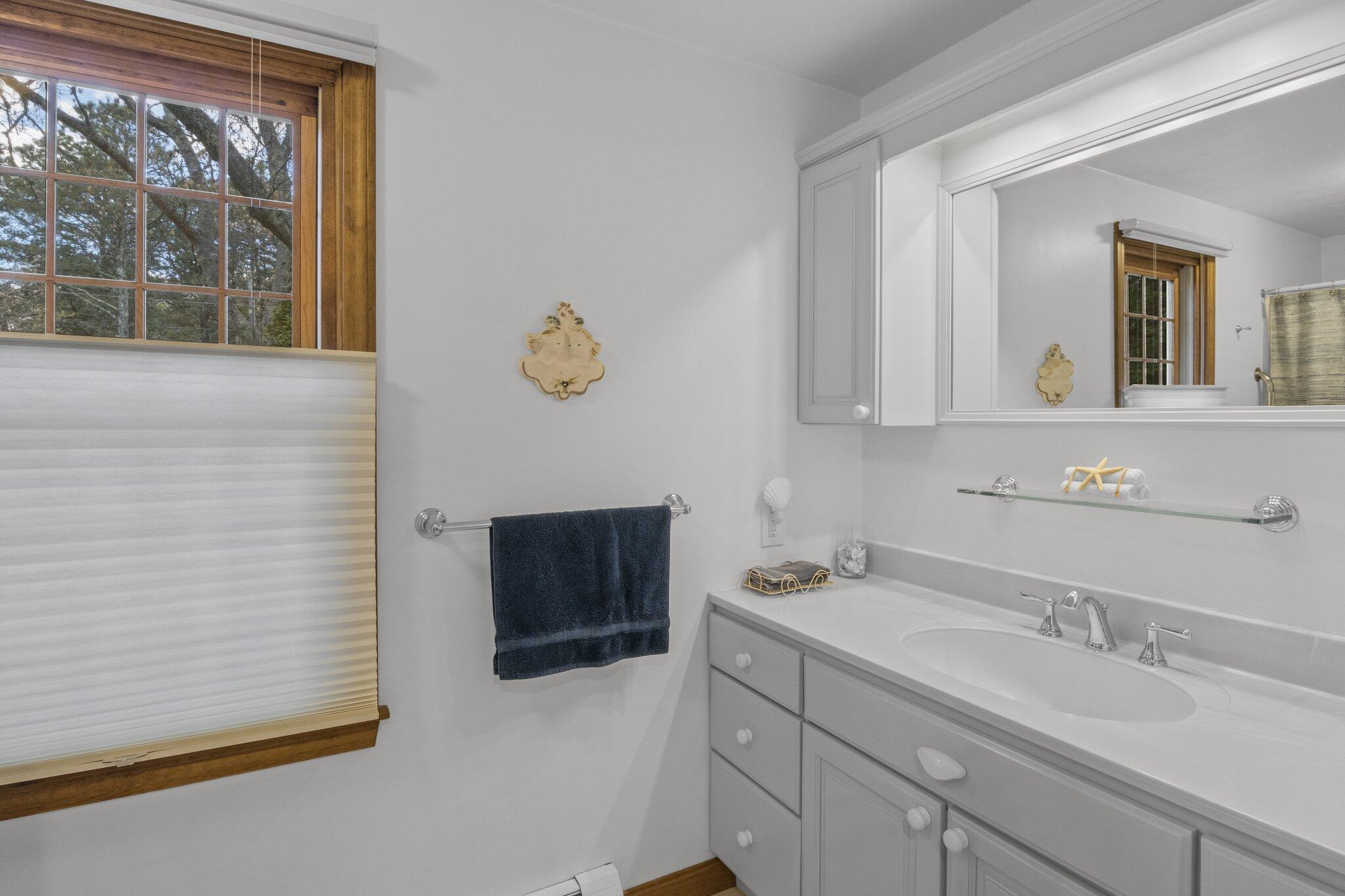 1363 Old Post Road Marstons Mills, MA 02648 - Photo 18 of 41 a bathroom with a sink and a mirror