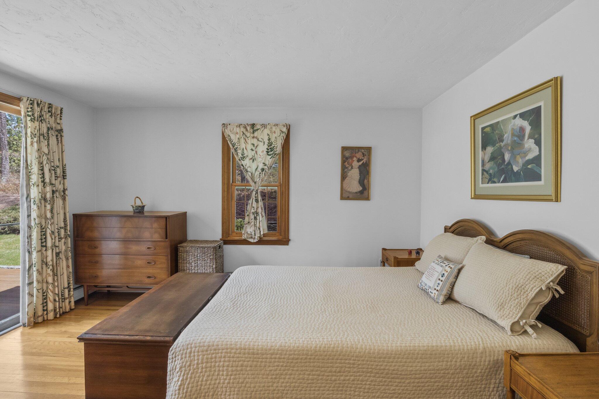 1363 Old Post Road Marstons Mills, MA 02648 - Photo 19 of 41 a bedroom with a bed and a painting on the wall