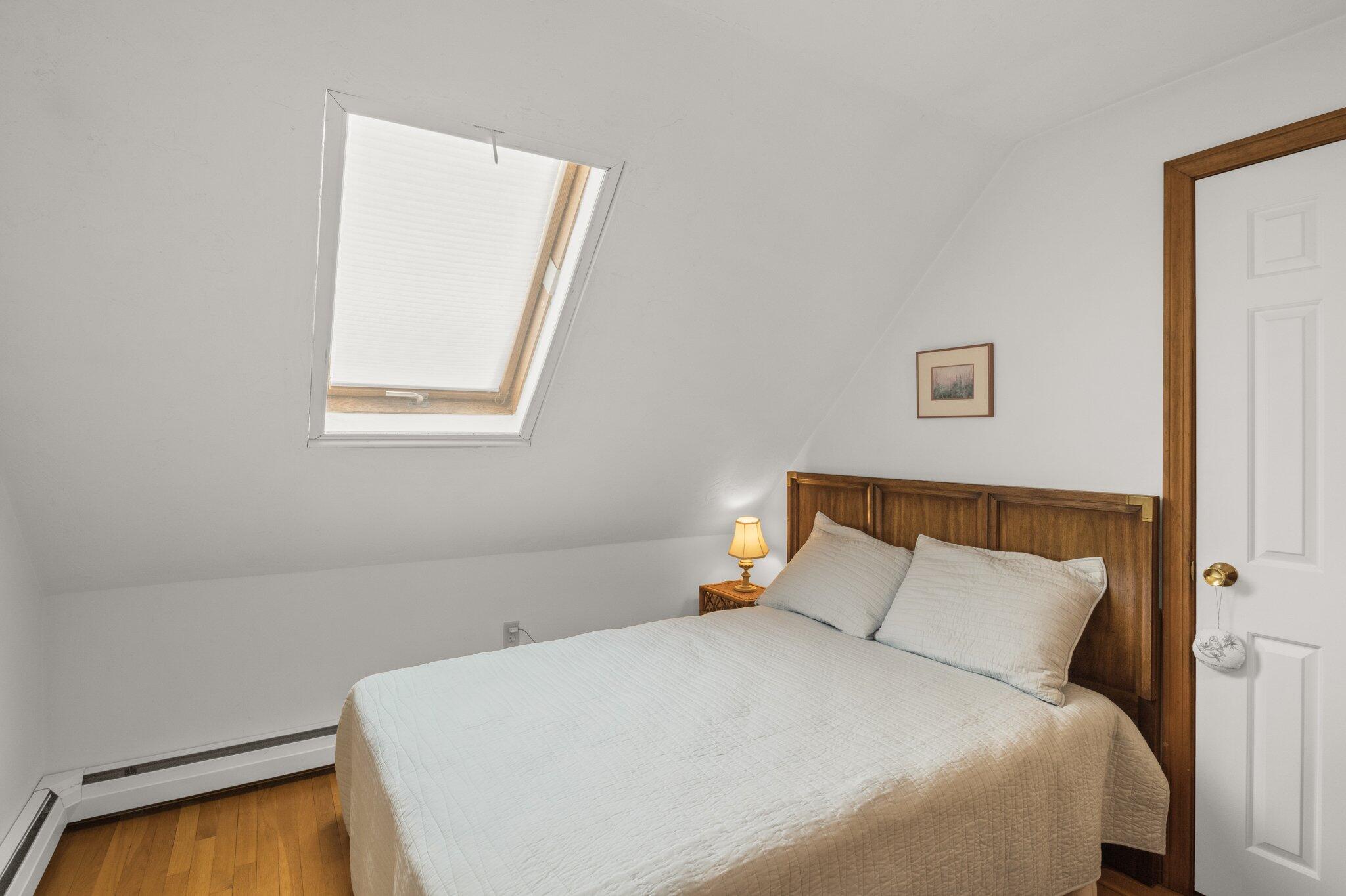 1363 Old Post Road Marstons Mills, MA 02648 - Photo 26 of 41 a large bed sitting in a bedroom next to a window