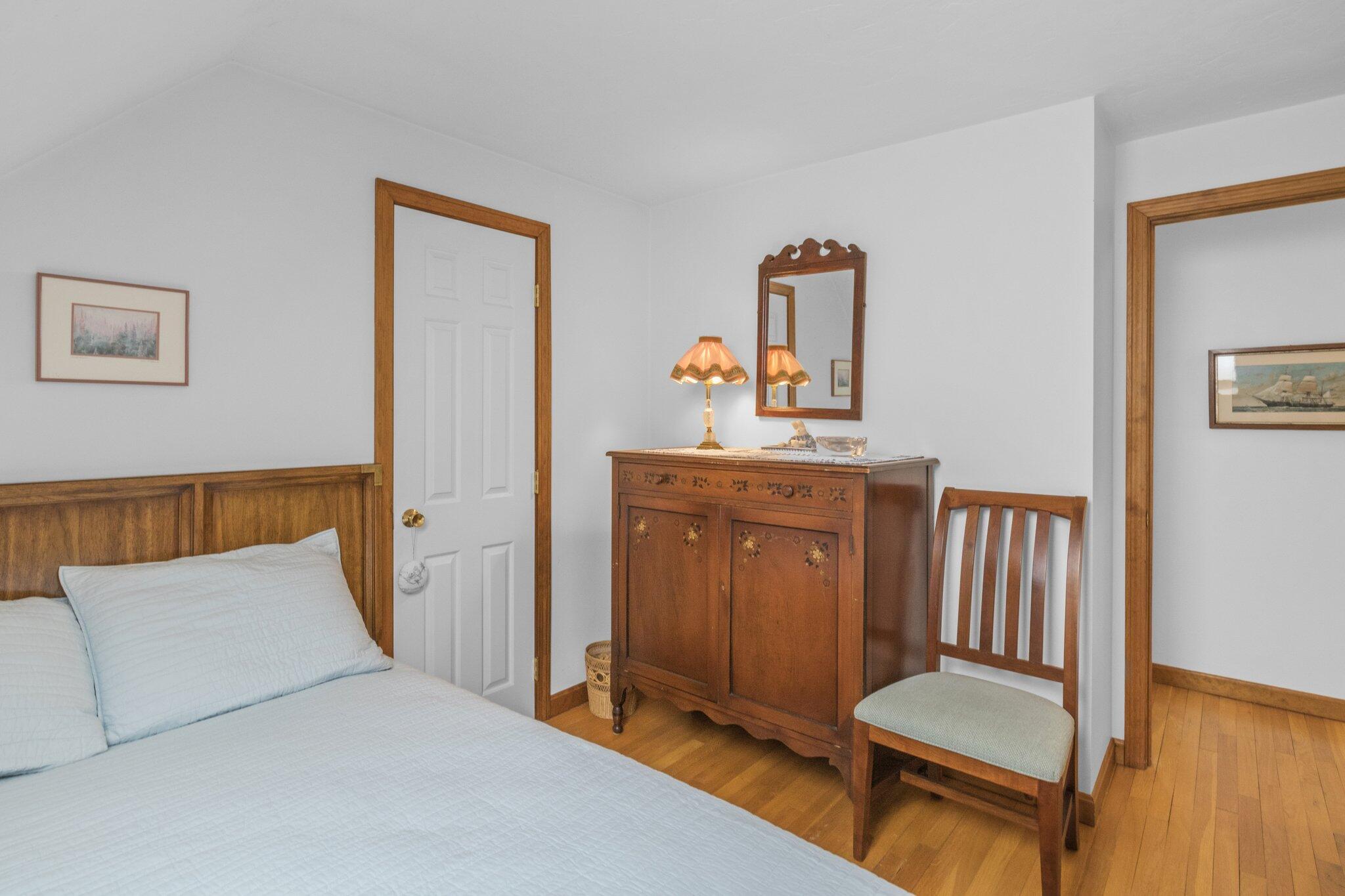 1363 Old Post Road Marstons Mills, MA 02648 - Photo 27 of 41 a bedroom with a bed and wooden floor