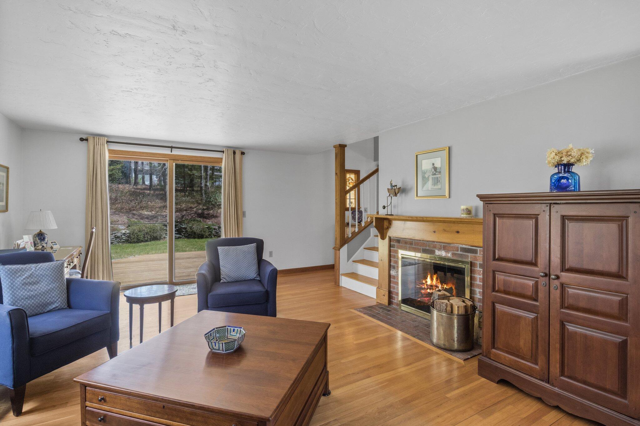 1363 Old Post Road Marstons Mills, MA 02648 - Photo 30 of 41 a living room with furniture a window and a fireplace