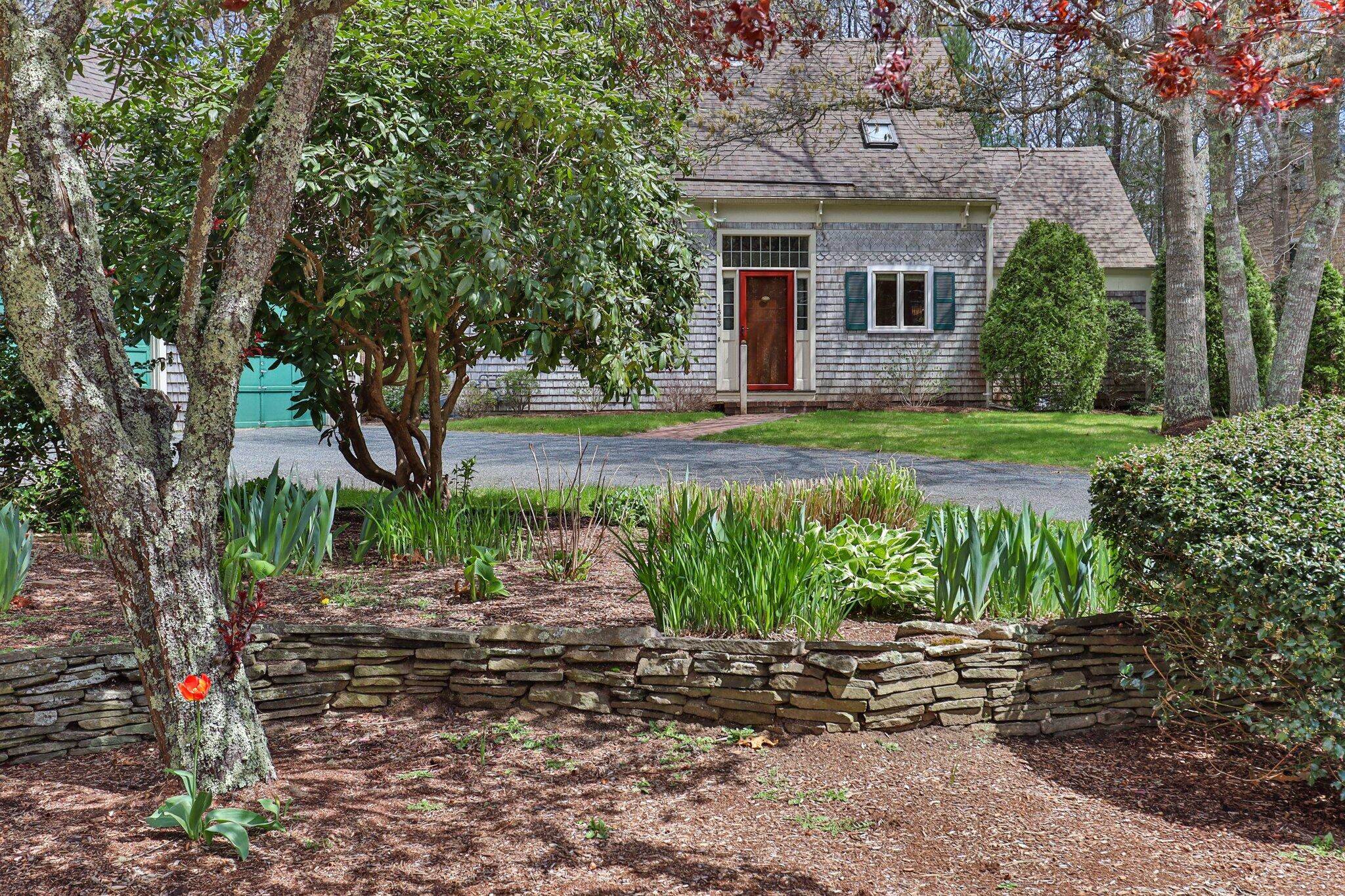 1363 Old Post Road Marstons Mills, MA 02648 - Photo 7 of 41 a front view of a house with garden