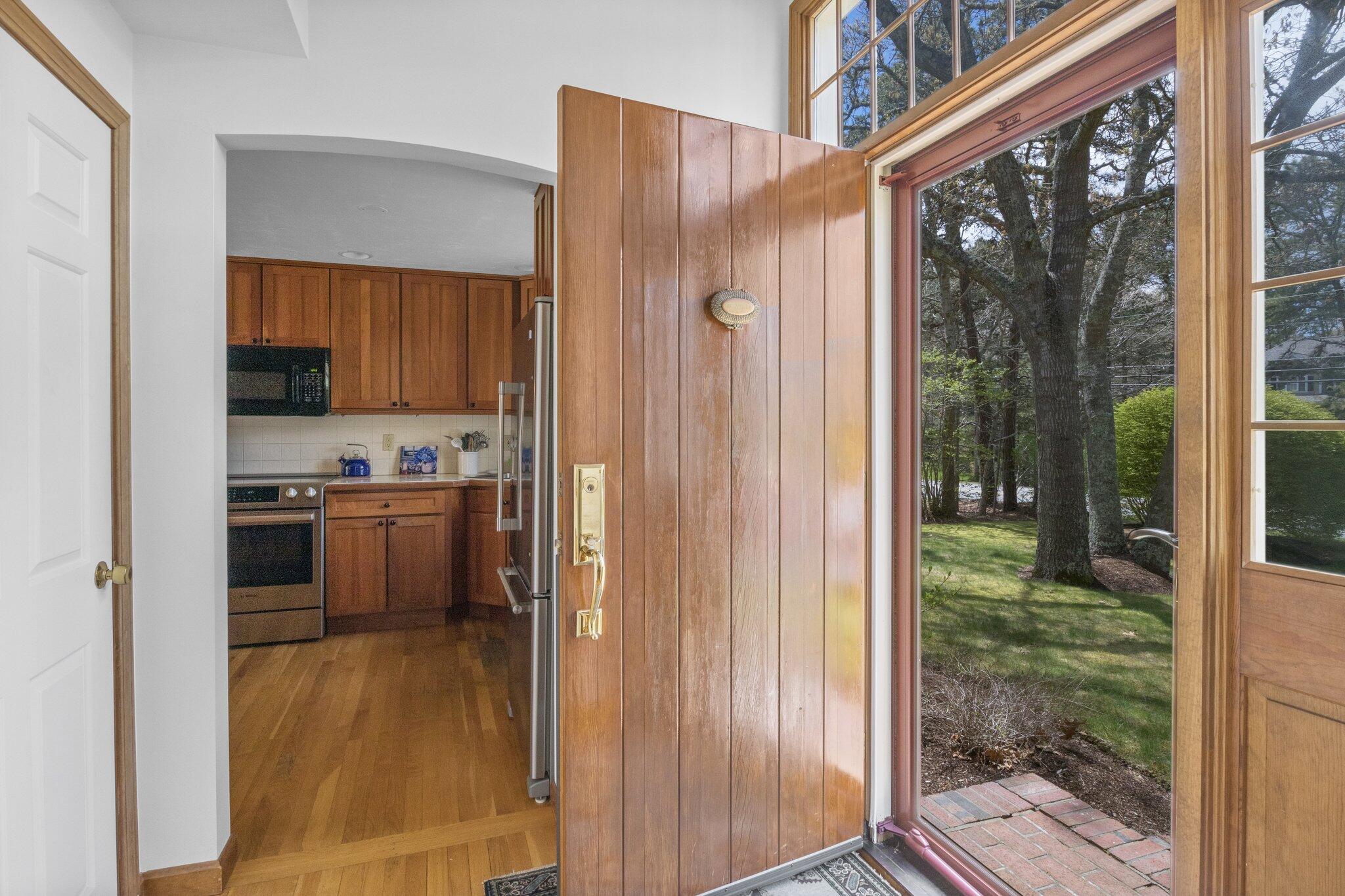 1363 Old Post Road Marstons Mills, MA 02648 - Photo 8 of 41 a kitchen view with a refrigerator a stove and a cabinets