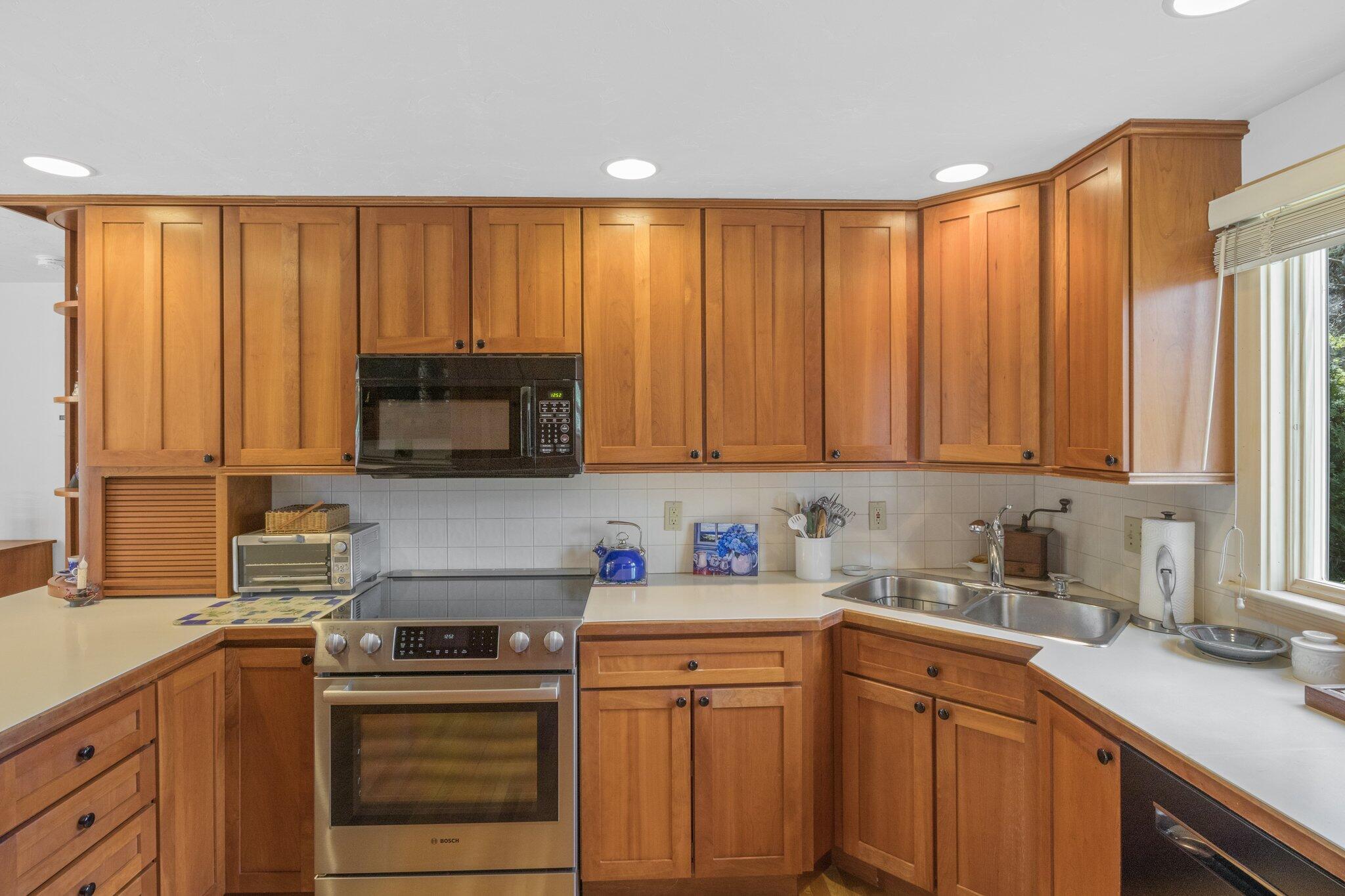 1363 Old Post Road Marstons Mills, MA 02648 - Photo 10 of 41 a kitchen with stainless steel appliances granite countertop a refrigerator sink and cabinets
