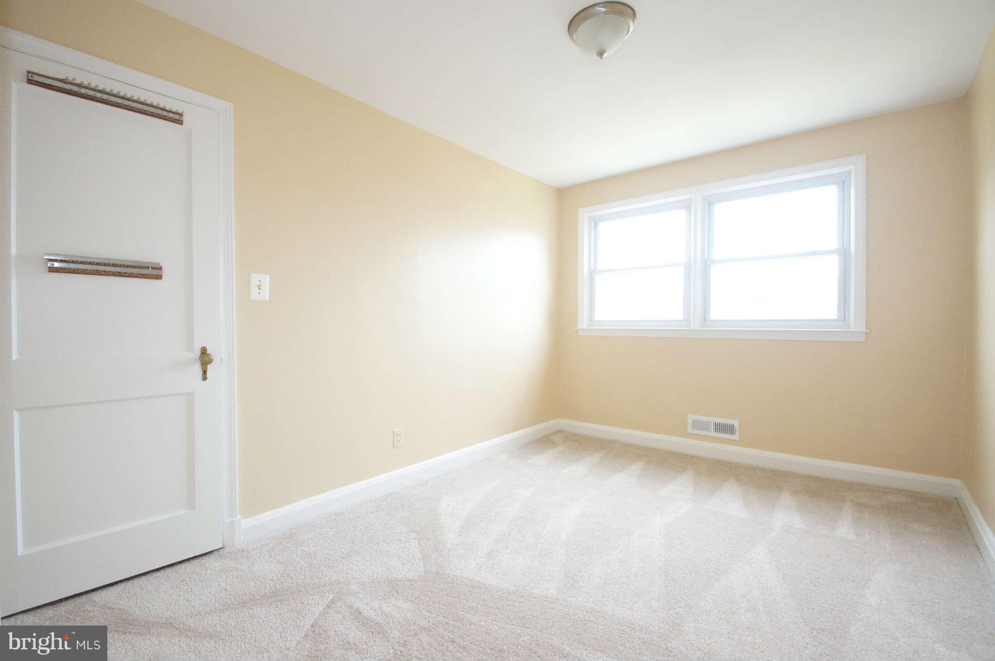 1423 Langford Road Baltimore, MD 21207 - Photo 16 of 30 an empty room with windows