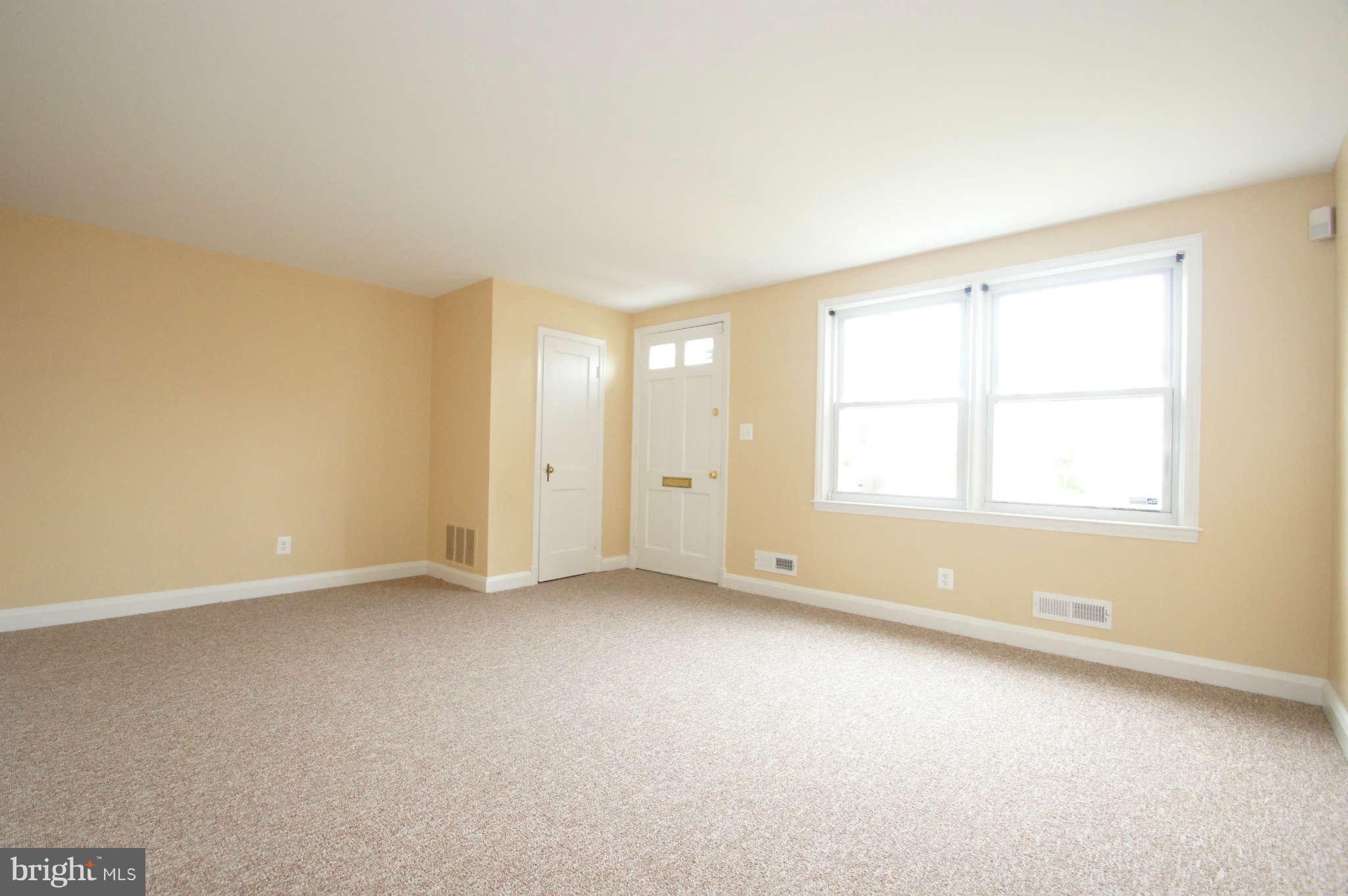 1423 Langford Road Baltimore, MD 21207 - Photo 3 of 30 an empty room with windows