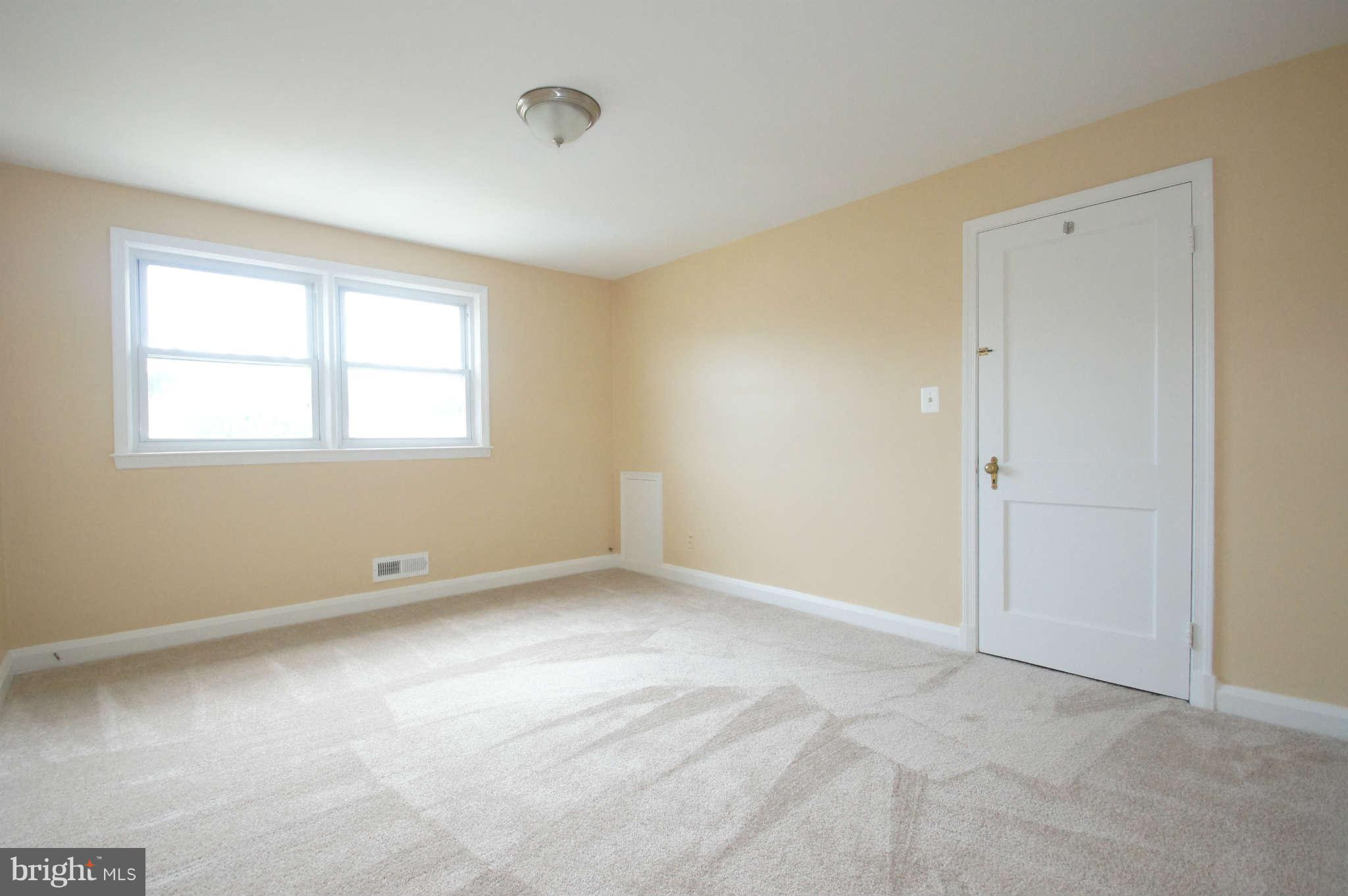 1423 Langford Road Baltimore, MD 21207 - Photo 21 of 30 an empty room with windows