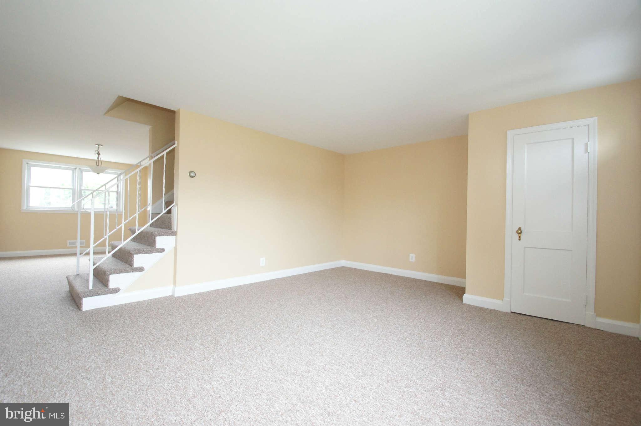 1423 Langford Road Baltimore, MD 21207 - Photo 4 of 30 a view of an empty room with stairs