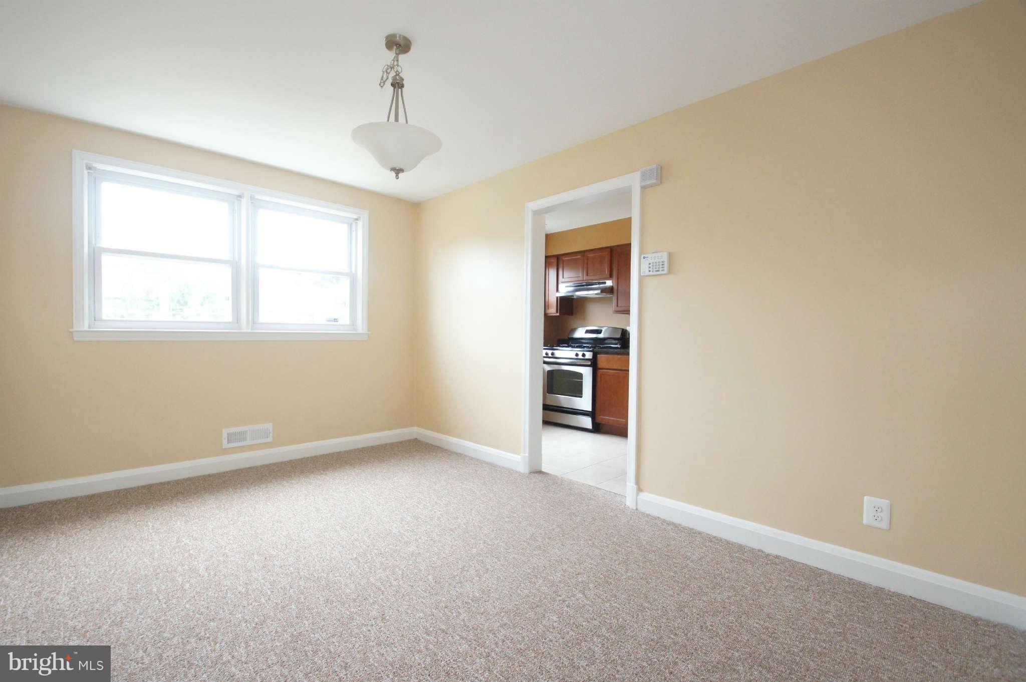 1423 Langford Road Baltimore, MD 21207 - Photo 8 of 30 an empty room with windows