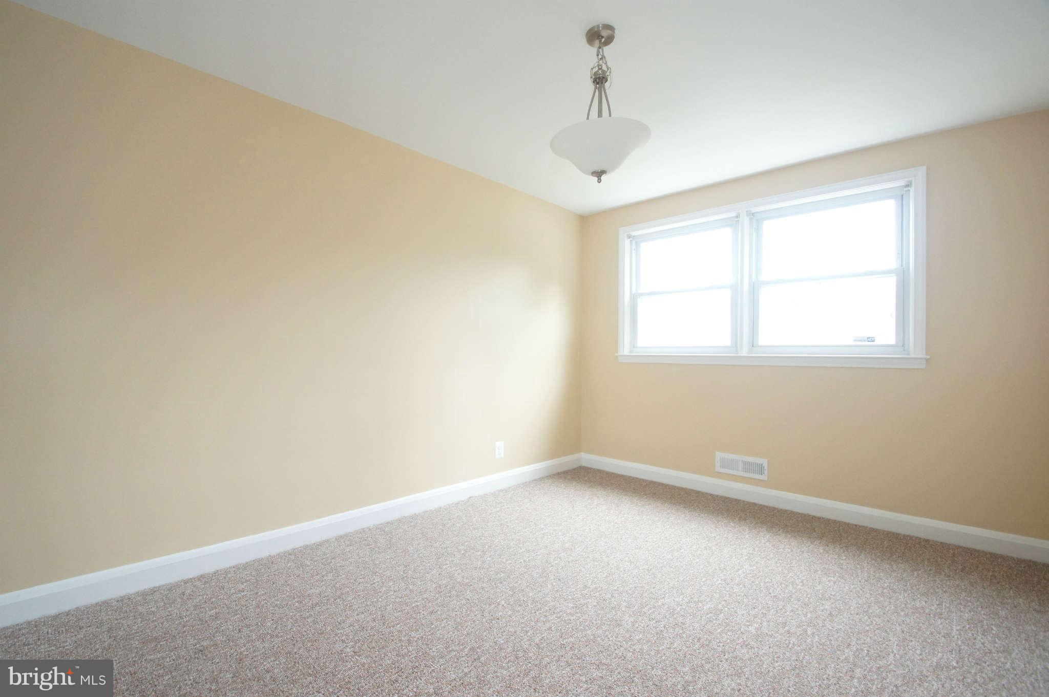 1423 Langford Road Baltimore, MD 21207 - Photo 9 of 30 an empty room with a window
